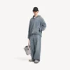 Baggy herenjeans met denimstiksels in donkerblauw