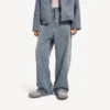 Baggy herenjeans met denimstiksels in donkerblauw