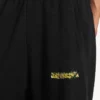 Baggy joggingbroek voor heren met ‘messy spray’-print in zwart