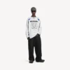 Balenciaga voor heren | NBA-samenwerking: oversized T-shirt met lange mouwen in wit/meerkleurig