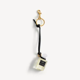Bedeltje in de vorm van een miniatuurparfumflesje in zwart