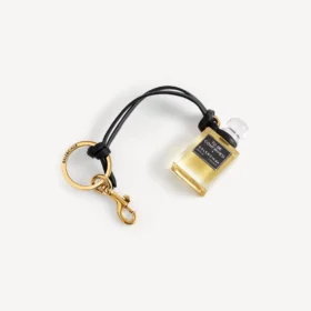 Bedeltje in de vorm van een miniatuurparfumflesje in zwart