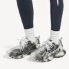 Dames-sneakers met stencil-logo in zwart/wit