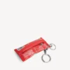 Heren sleutelhanger/bedeltje in de vorm van een snackzakje in rood
