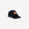 Herenpet met logo in marineblauw